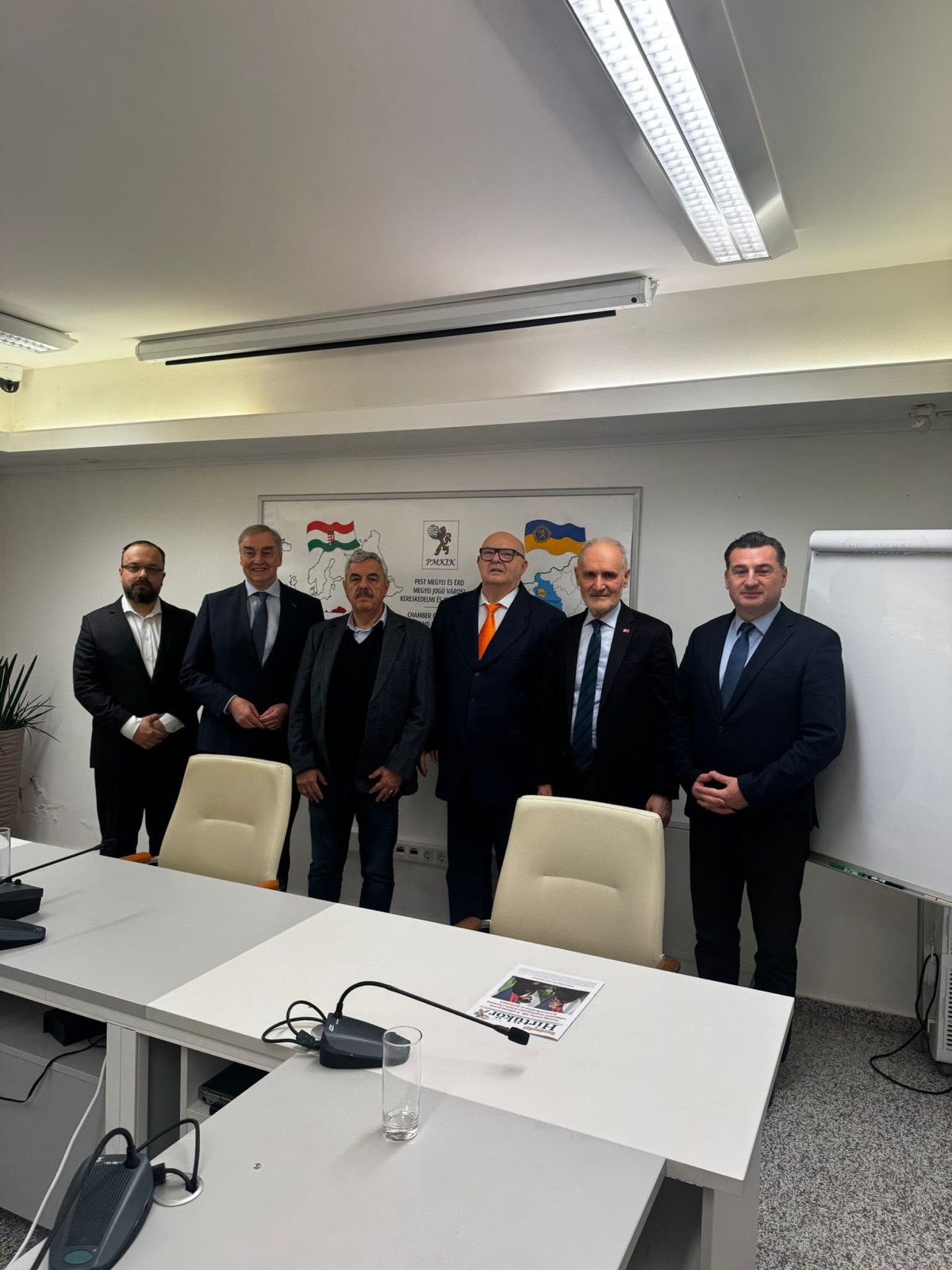 DCCF Board members standing together in a meeting room of the Pest County Chamber in Törökbálint