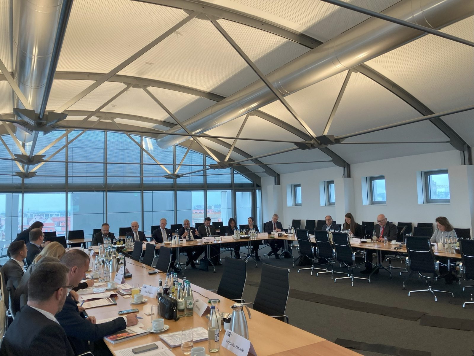 Delegates around the conference tables at the DCCF General Assembly in Ulm