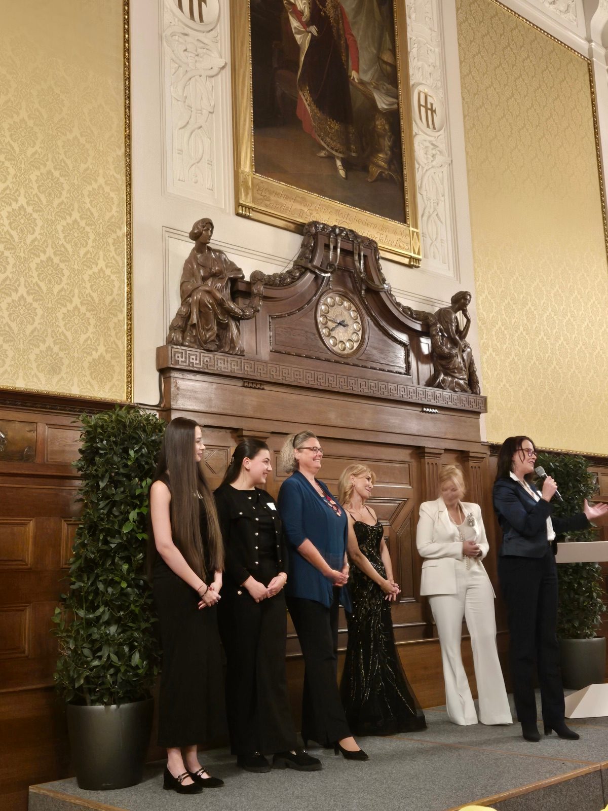 Women on stage in a ceremonial hall at the Women in Business networking event in Vienna